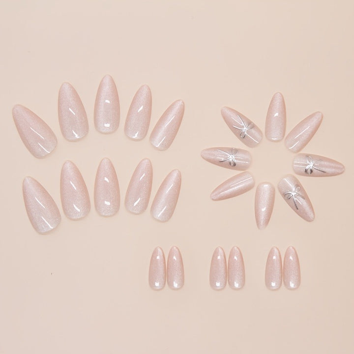 Artificial nail set with delicate glitter and elegant bow decorations Kalsten