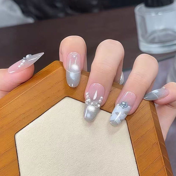 Artificial nail set with glamorous 3D details and radiant accents Kalsten