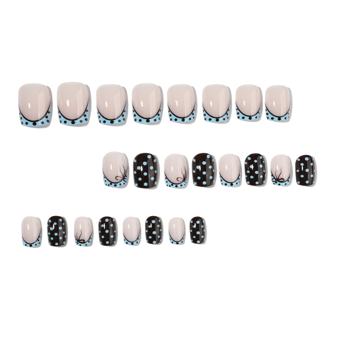 Artful nail extensions with playful dots and elegant design Kalsten