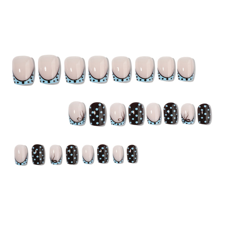 Artful nail extensions with playful dots and elegant design Kalsten