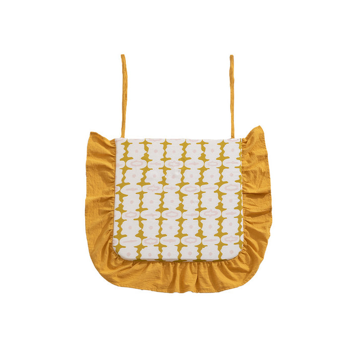 Padded chair cushion with ties, ruffled edge and embroidered hole pattern look Kalsten