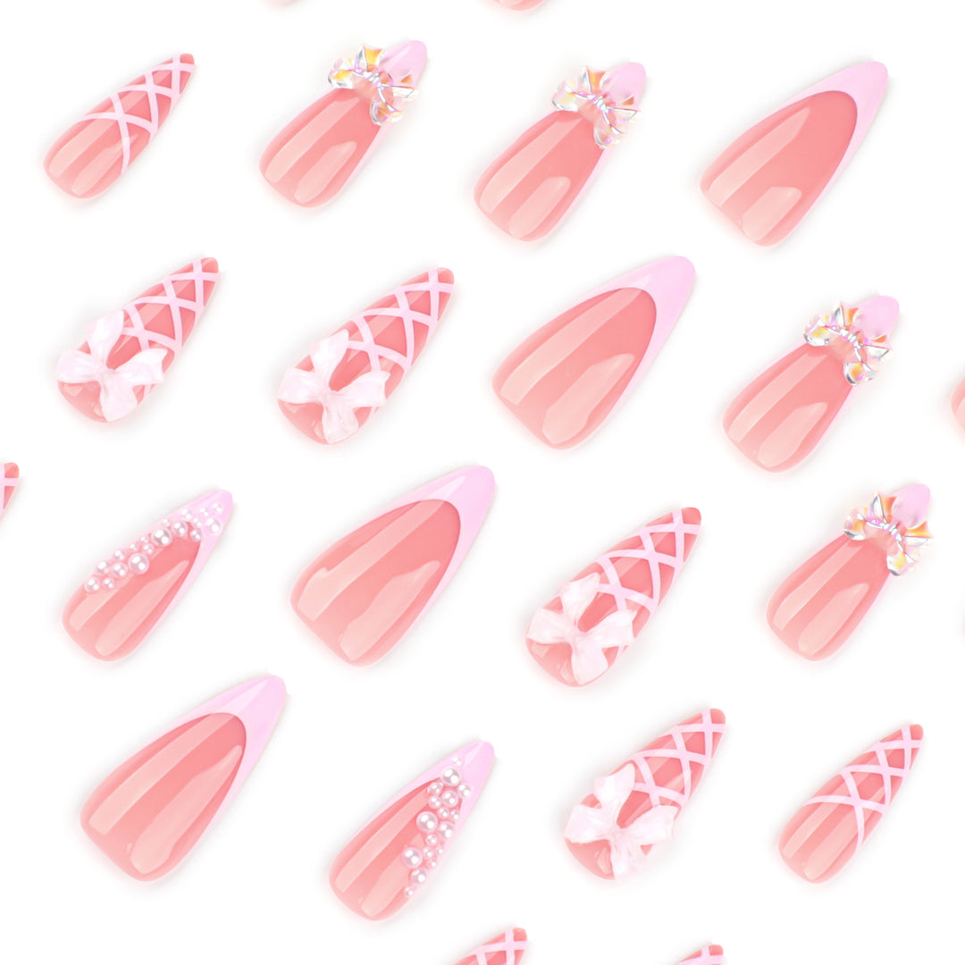 Artful stiletto nails with glitter and bow decoration Kalsten