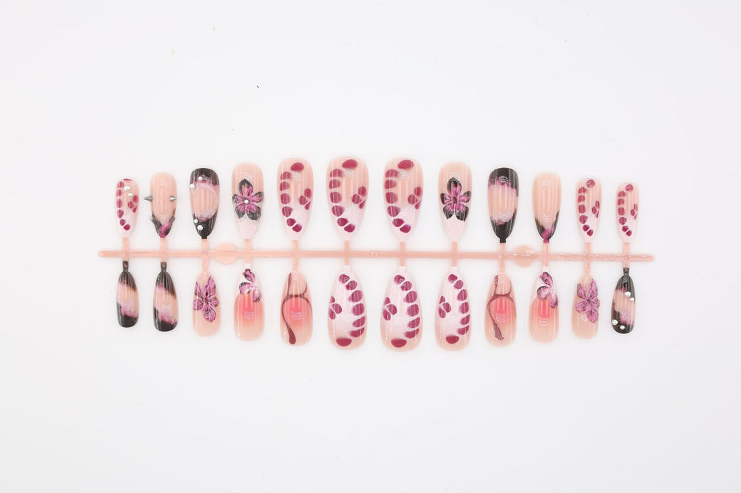 Acrylic nail set with elegant floral design and glossy accents Kalsten