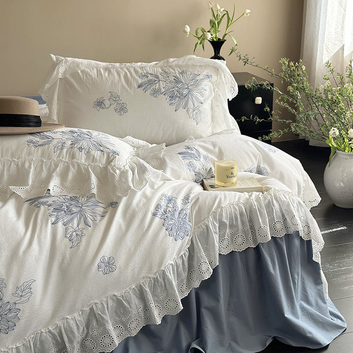 Embroidered bedding set in country house style with ruffled edging and eyelet lace