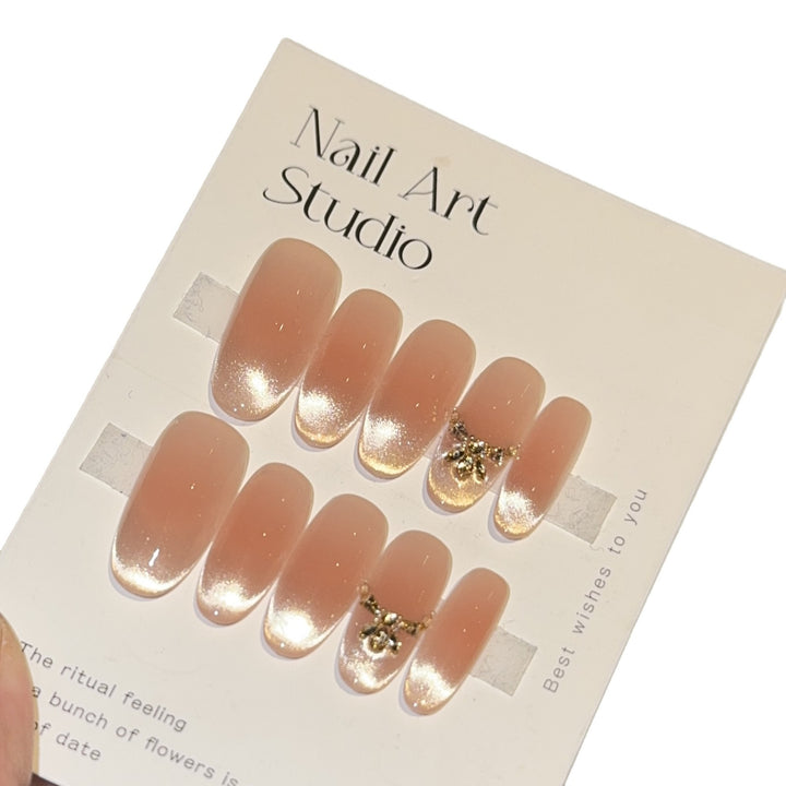 Artificial nails with elegant tip design and gold accents Kalsten