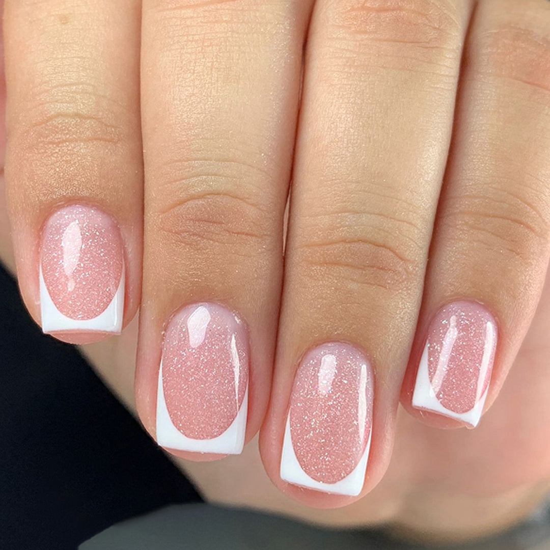 Sparkling nail art with elegant French tip design Kalsten