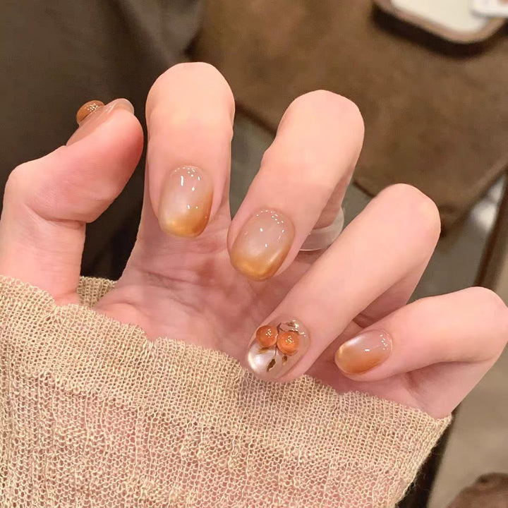 Artificial nails with elegant ombre effect and floral accents Kalsten