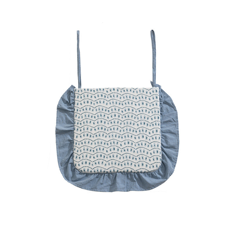 Padded chair cushion with ties, ruffled edge and embroidered hole pattern look Kalsten