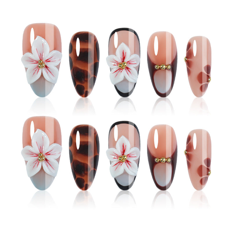 Acrylic nail set with floral accents and elegant embellishments Kalsten