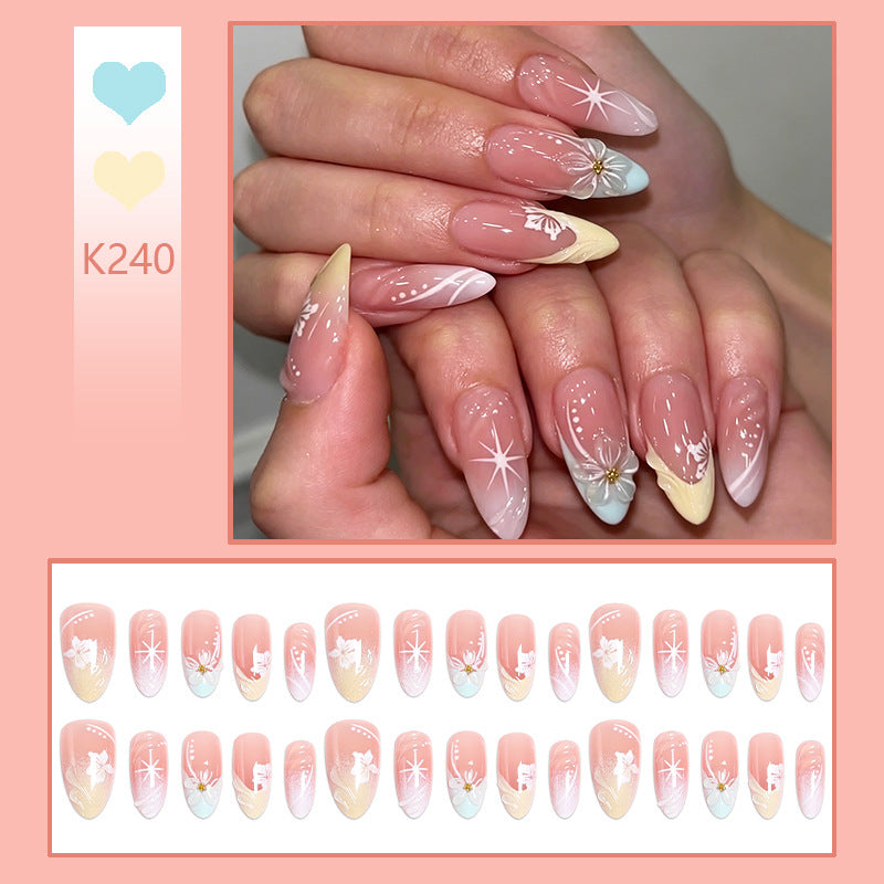 Artificial nail set with intricately detailed floral designs and shine accents Kalsten
