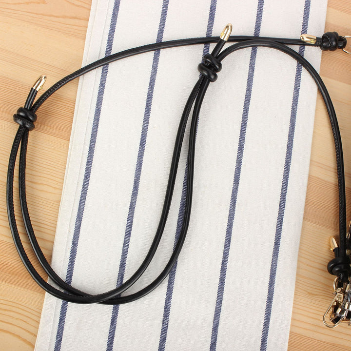 Shoulder bag made of handwoven synthetic material with fashionable sliding mechanism Kalsten