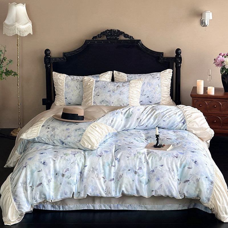 Elegant satin bedding set with watercolor floral pattern, ruffles and gathered pillowcases