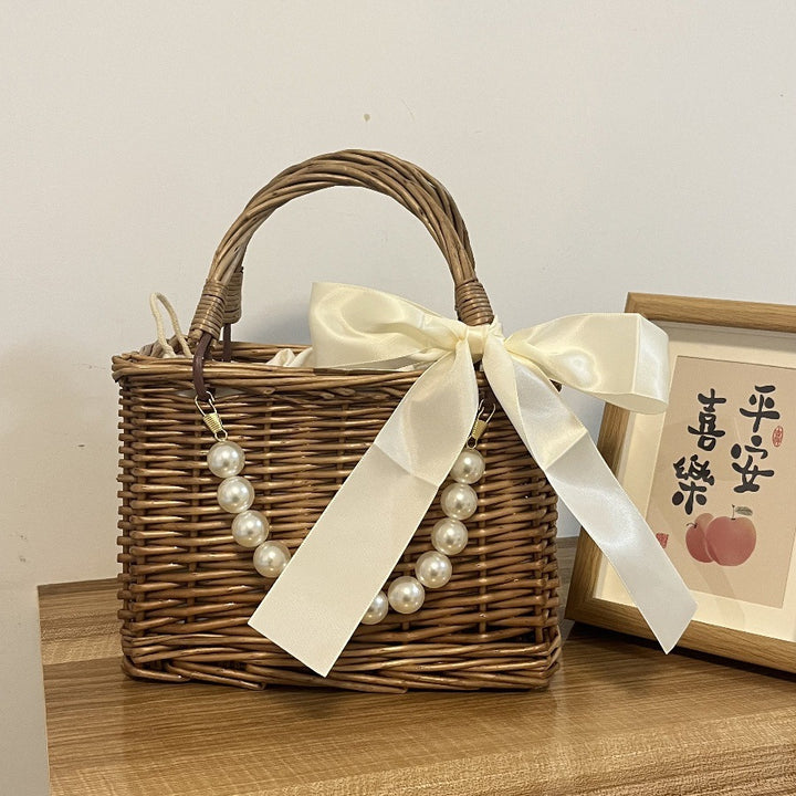Ladies' basket bag with decorative pearl accents and bow decoration Kalsten