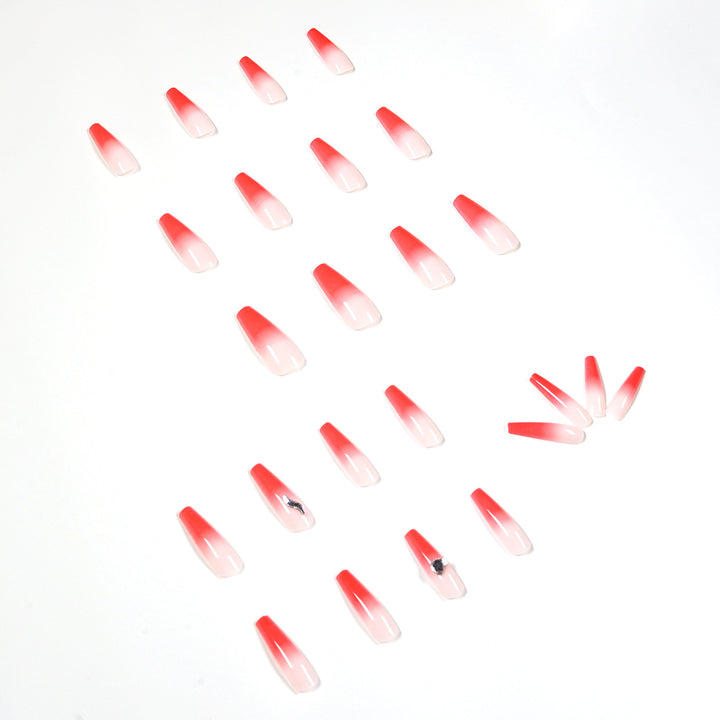 Artful stiletto nails with elegant gradient and rhinestone embellishment Kalsten
