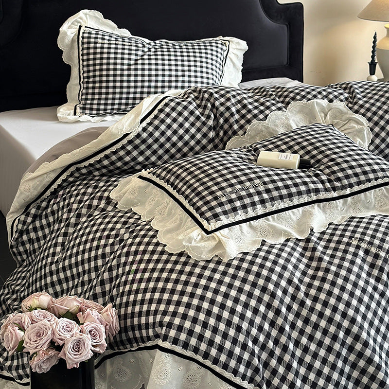 Quilted bedding set made of cotton blend with check pattern and decorative lace ruffle