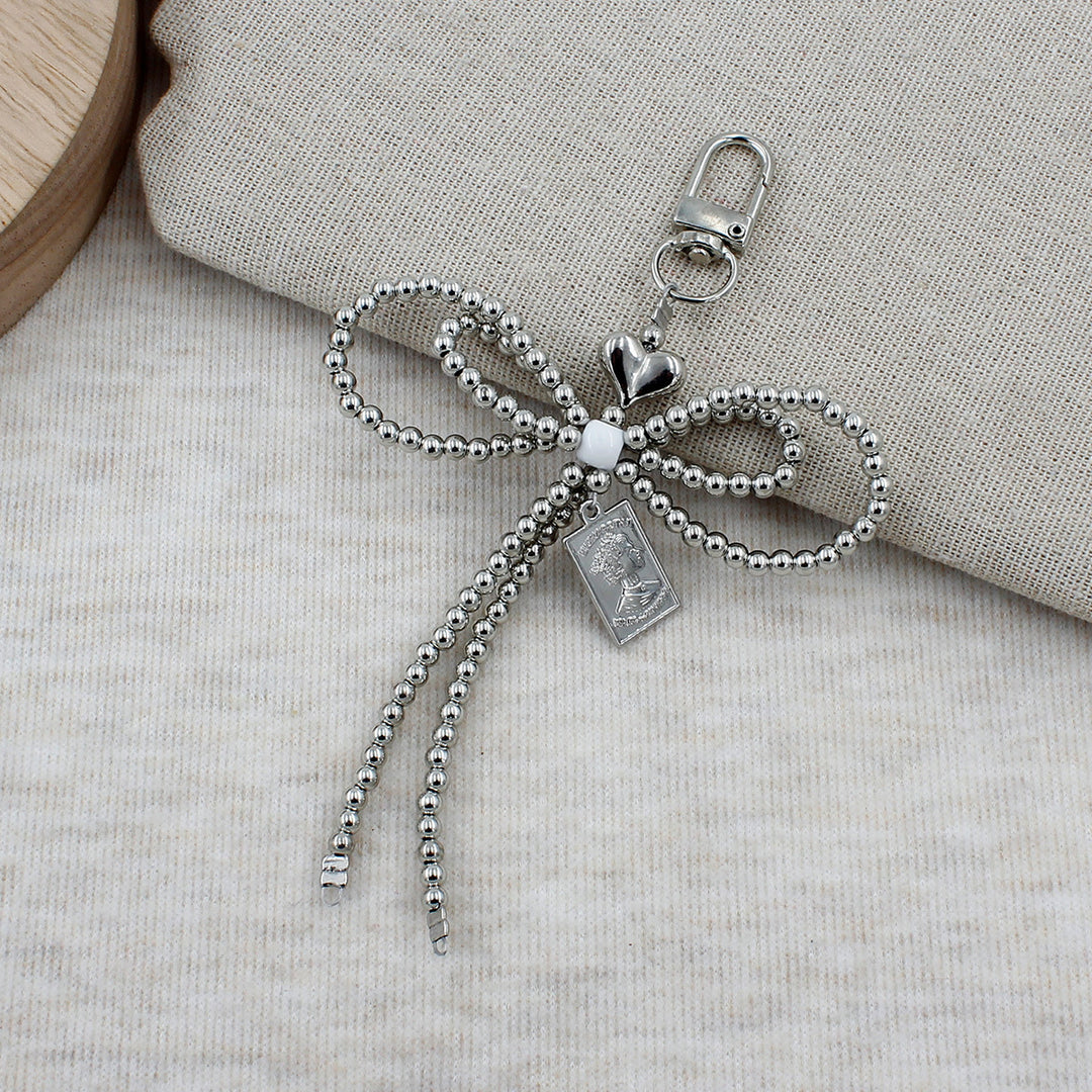 Elegant Beaded Bow Brooch Kalsten