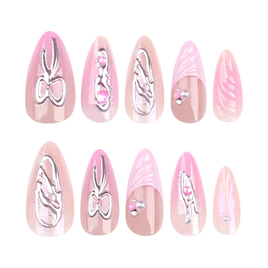Artful stiletto nails with glitter and pearl decorations Kalsten