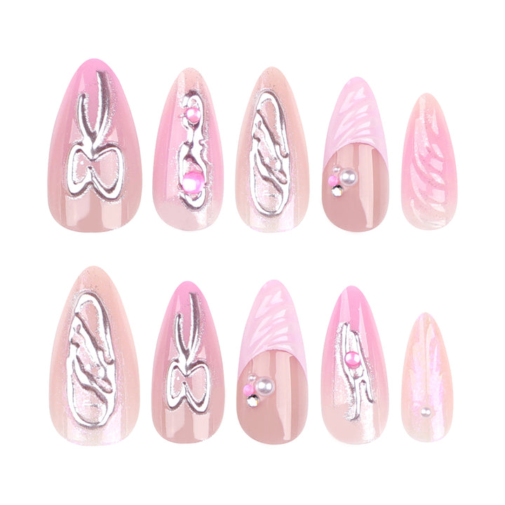 Artful stiletto nails with glitter and pearl decorations Kalsten
