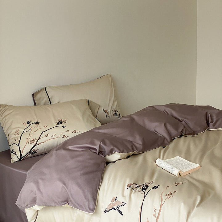 Reversible cotton satin bed set with finely embroidered bird and branch motifs