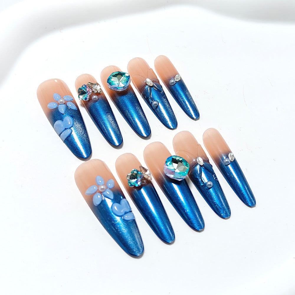 Artificial nails in elegant design with artistic decorations and glitter accents Kalsten