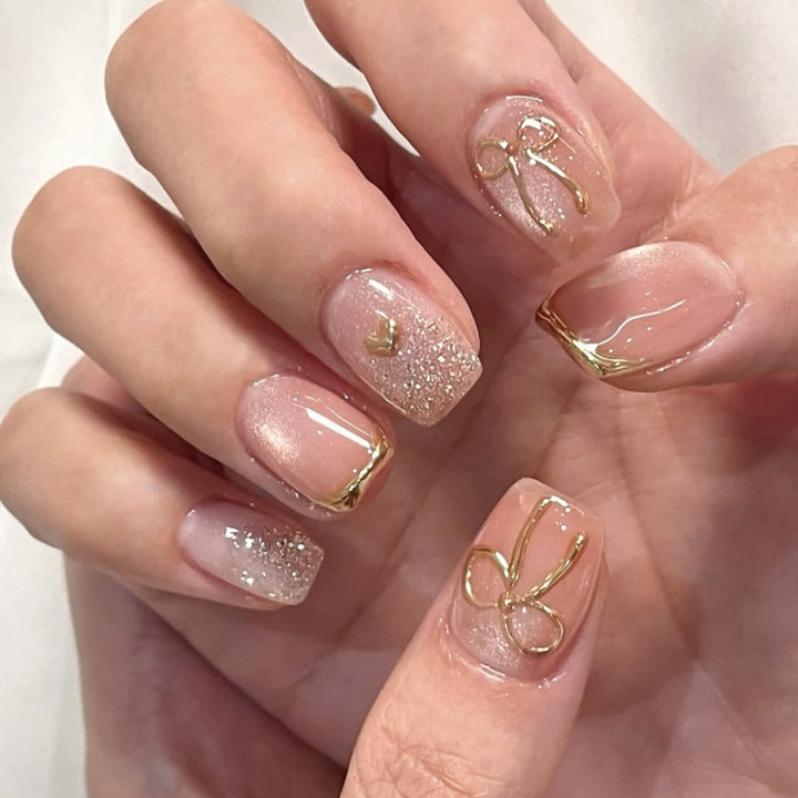 Glamorous acrylic nails with elegant gold design Kalsten
