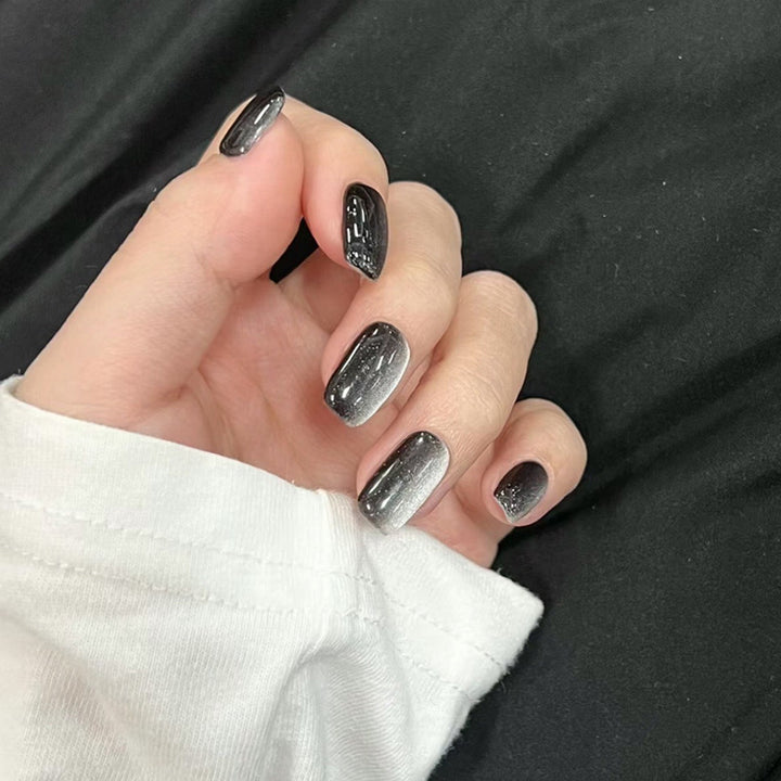 Artifical nail set with glamorous ombre effect and glitter embellishments Kalsten