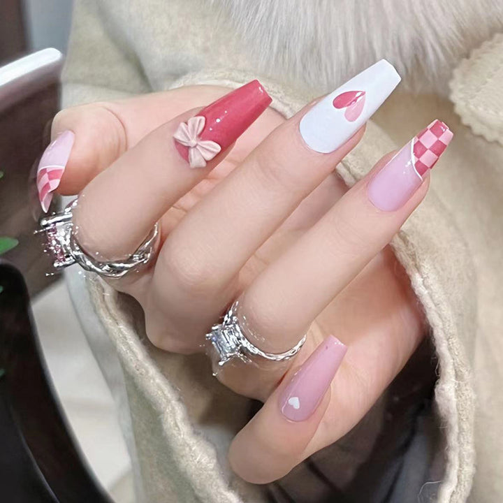 Artful nail extensions with playful designs and romantic accents Kalsten