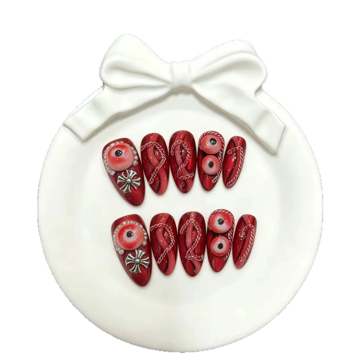 Artistic Press-On Nail Art Set with Unique Red Designs
