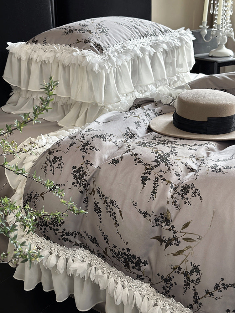 Satin bedding set with floral print duvet, tiered ruffle pillow & lace trim
