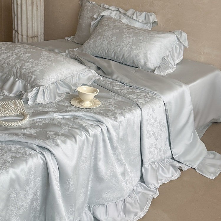 Luxury satin bedding set with floral jacquard pattern, ruffle, and silky finish