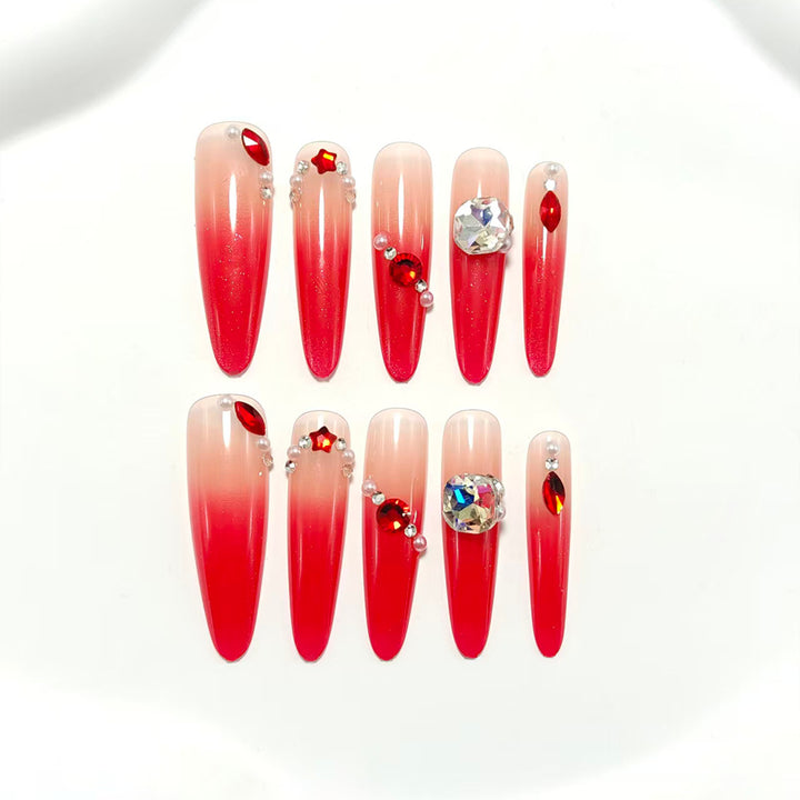 Artificial nails in elegant ombre style with glitter and jewelry accents Kalsten
