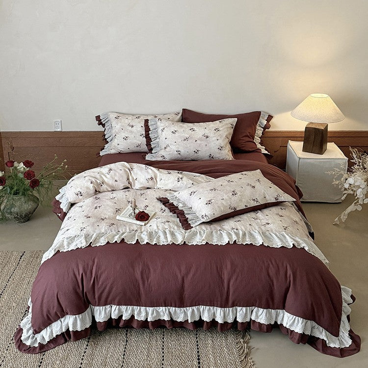 Romantic bed linen set with lace trim, ruffles, and fine floral print