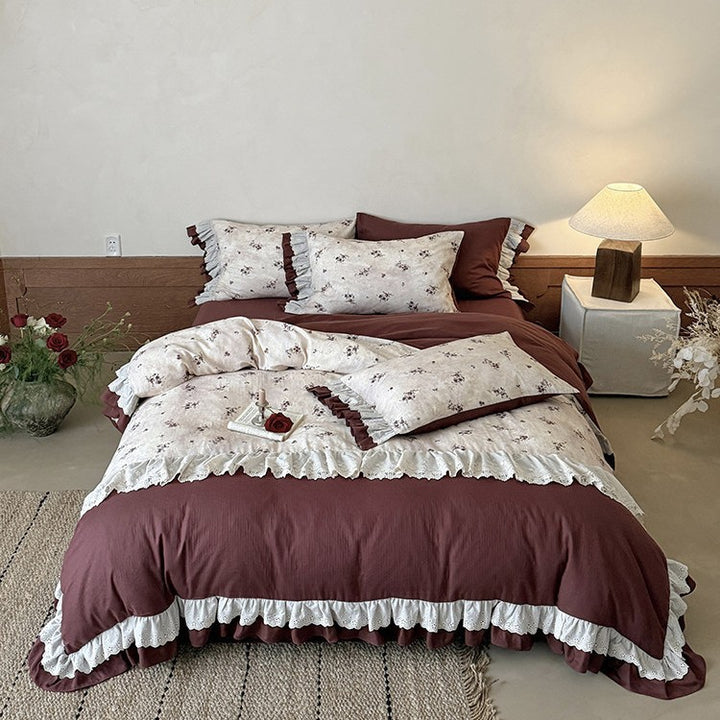 Romantic bed linen set with lace trim, ruffles, and fine floral print