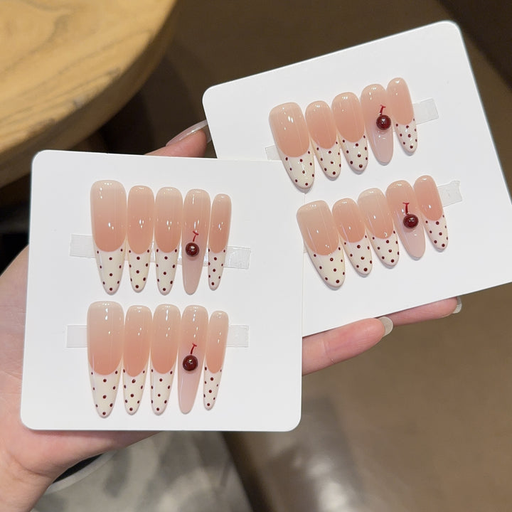 Artificial nails with playful design and cherry accents Kalsten