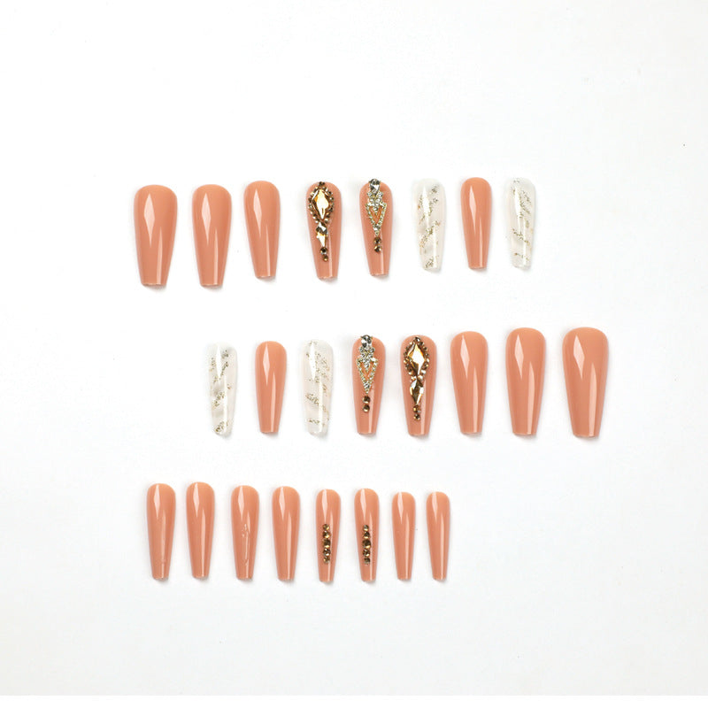 Artful nail extensions with glitter embellishments and delicate accents Kalsten