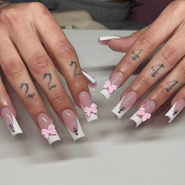 Trendy French-design artificial nails with bow accents Kalsten