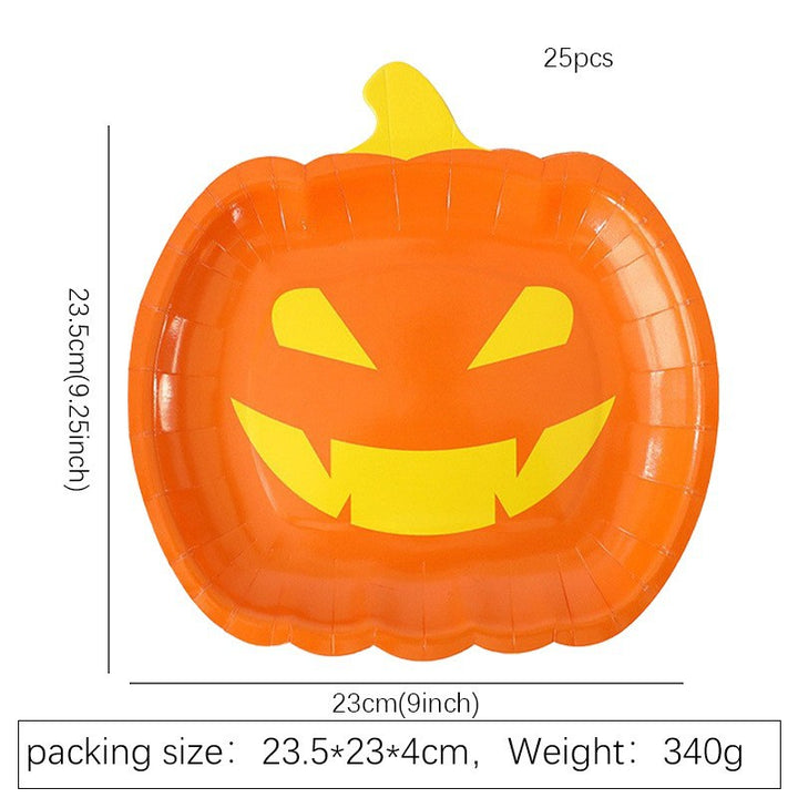Disposable paper plates in pumpkin shape with spooky face design