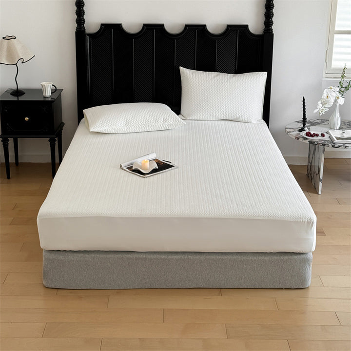 Comfort mattress topper with textured waffle surface and deep edge