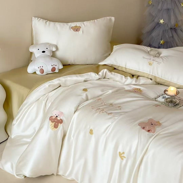 Luxurious satin bedding set with embroidered cherry motifs, reversible function and plush bunny pillow