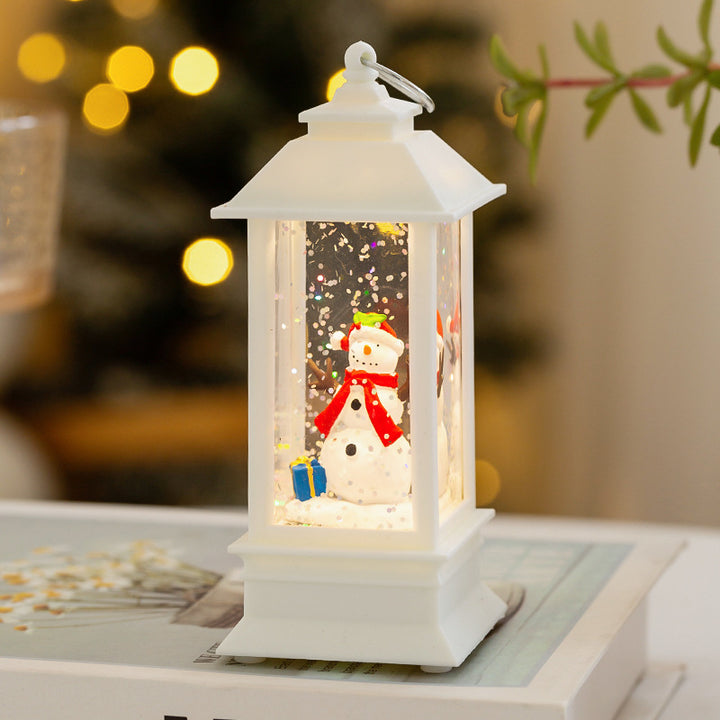 Christmas lantern with LED lighting and decorative snow effect