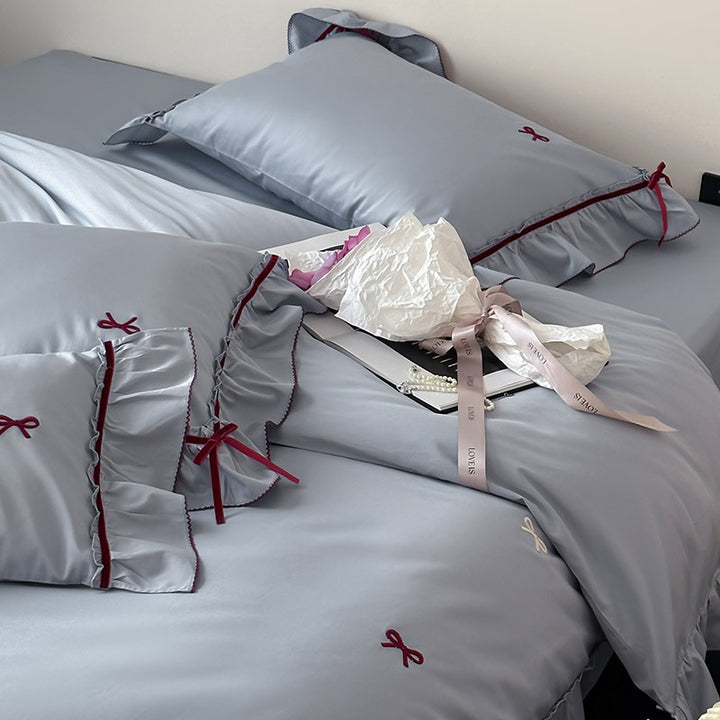 Premium bedding set made of cotton satin with ruffles and bow embroidery