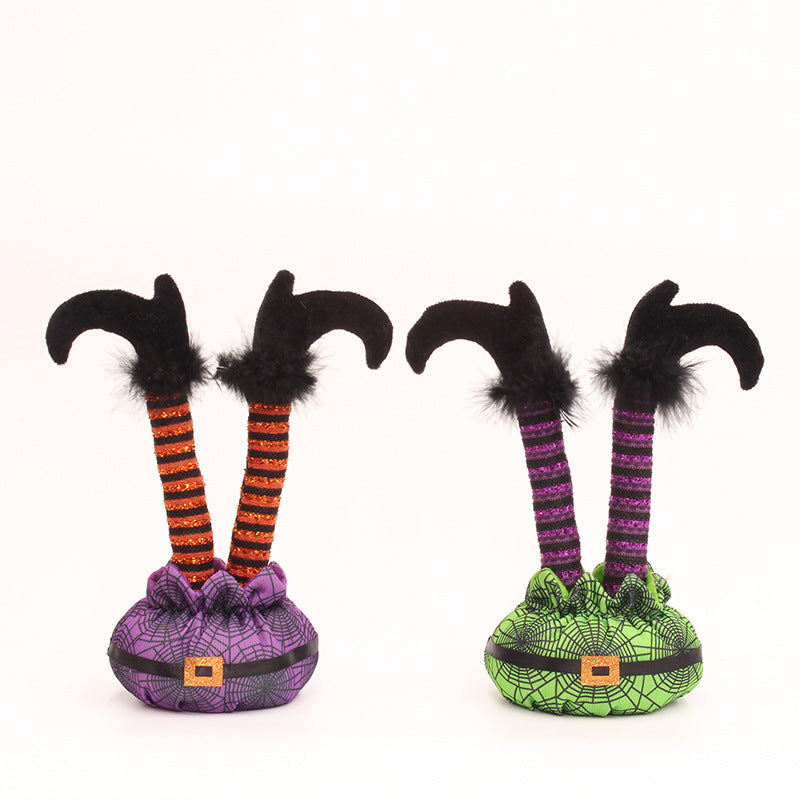 Skurrile Halloween table figure with standing witch legs and spider web sack