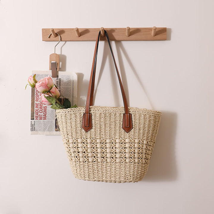 Handcrafted rattan basket bag with elegant leather accents Kalsten