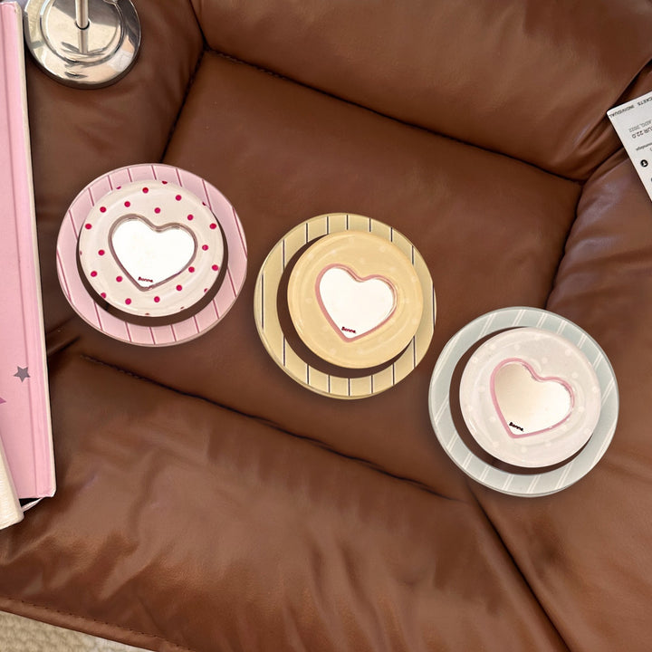 Heart-shaped coaster with playful design Kalsten