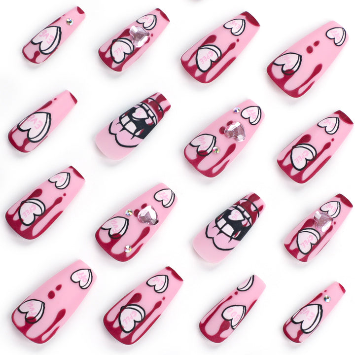 Artful stiletto nails with hearts and glitter accents Kalsten