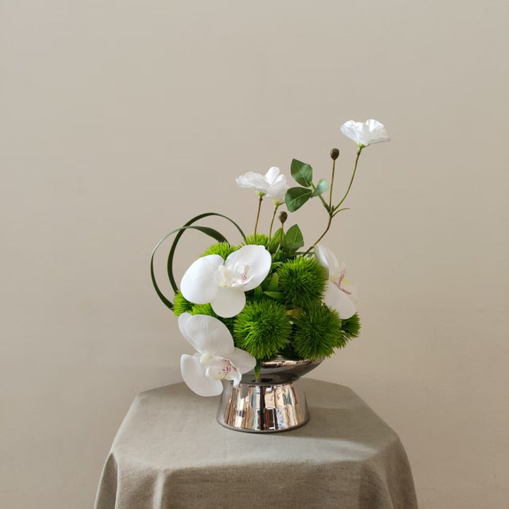 Lifelike Orchid and Greenery Floral Arrangement