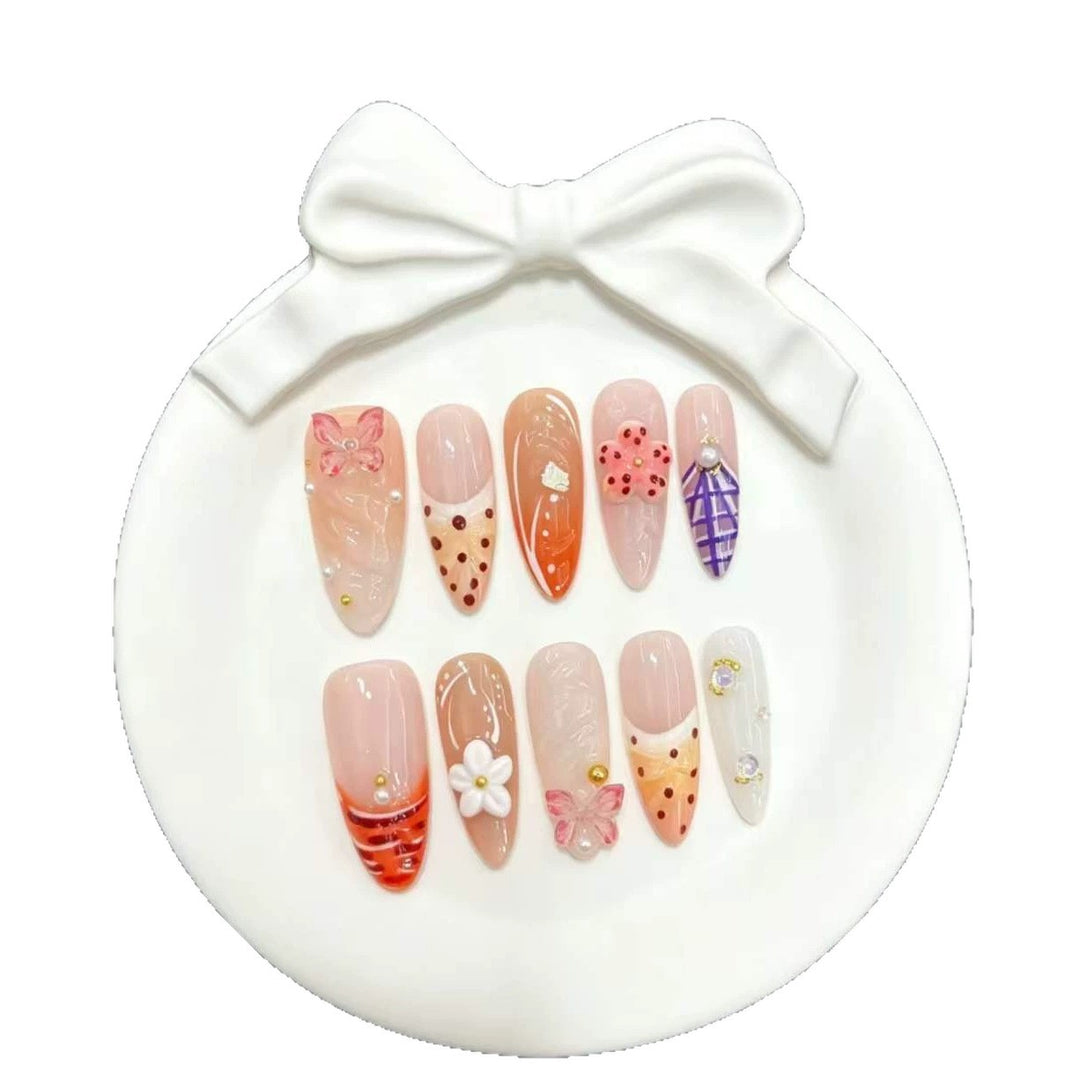 Artistic Press-On Nails Set with Floral and Decorative Accents