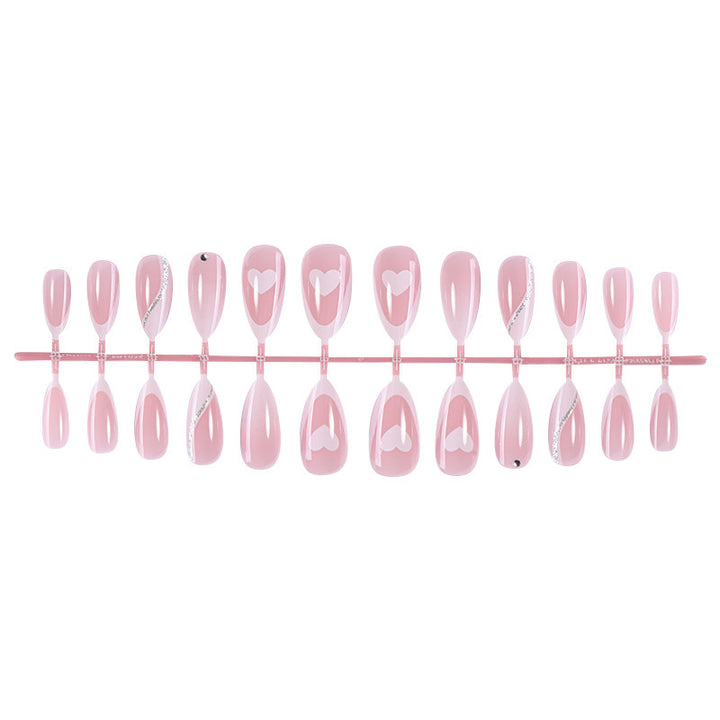 Acrylic nail set with romantic heart and glitter accents Kalsten