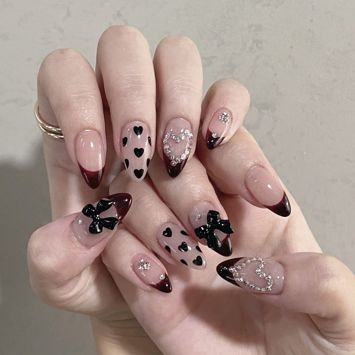 Artistic Stiletto Nail Art Extensions with Heart and Bow Accents Kalsten
