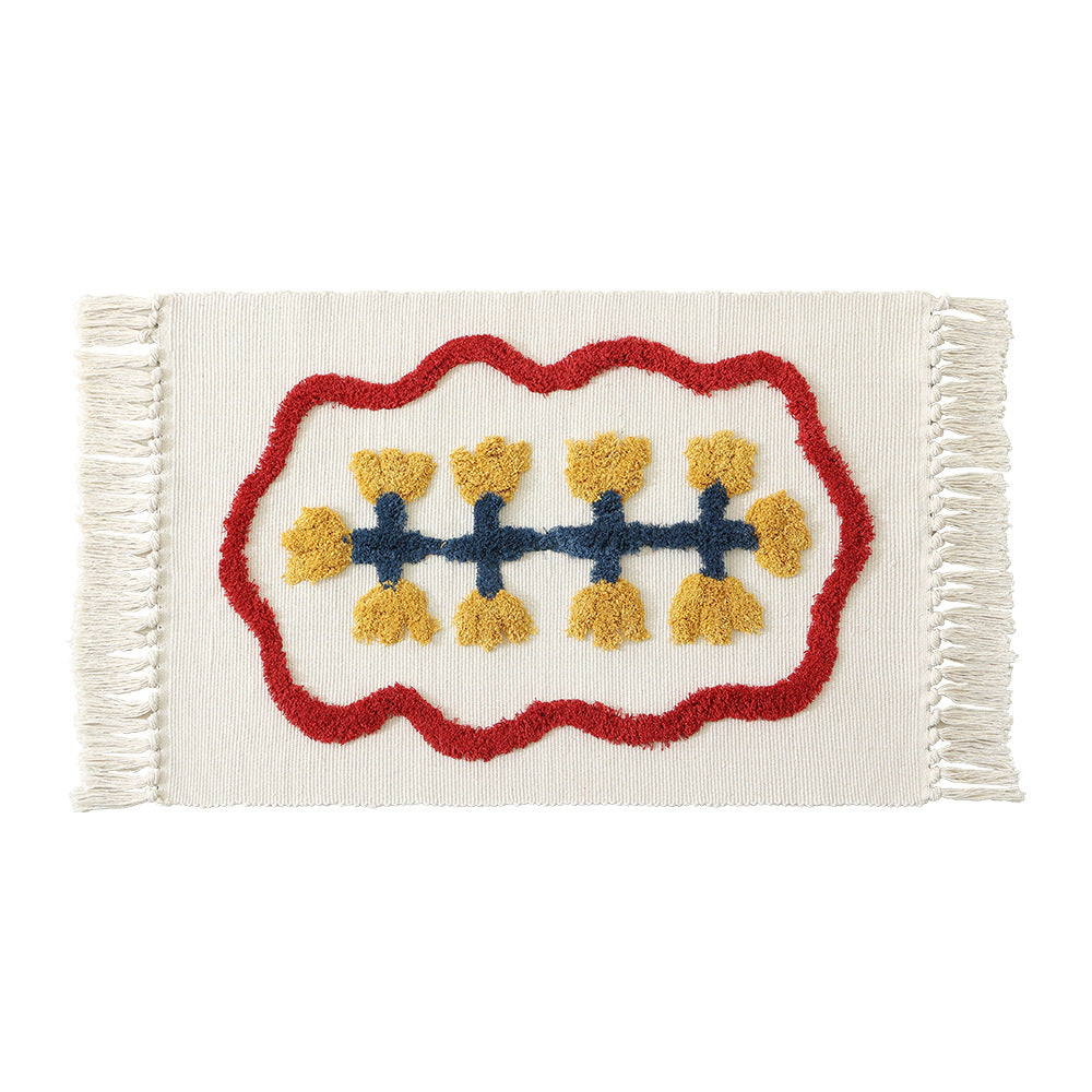 Handwoven cotton bath mat rug with tufted flower appliqué and tassels Kalsten
